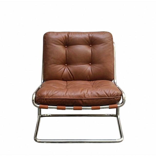 This lounge chair is a classic example of modernist design from the 1960s and 1970s. The chair is built around an elegant...