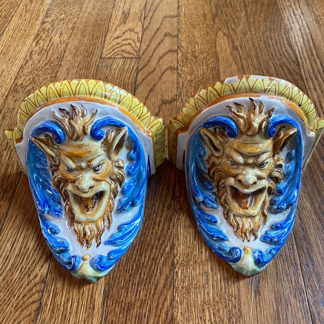 Listing is for a pair of antique Cantagalli majolica wall brackets in blue and white and yellow depicting the mythological...