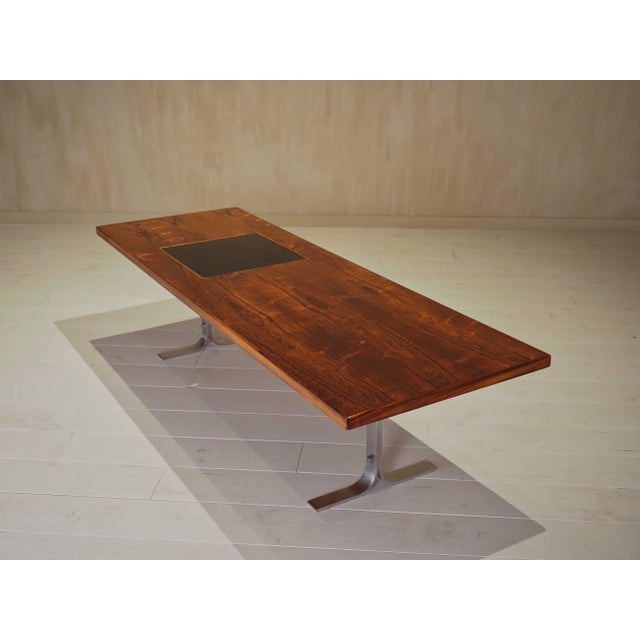 This rare "Model 66" coffee table by Danish designer Erik W. Bach is crafted from beautifully flamed Palisander wood,...