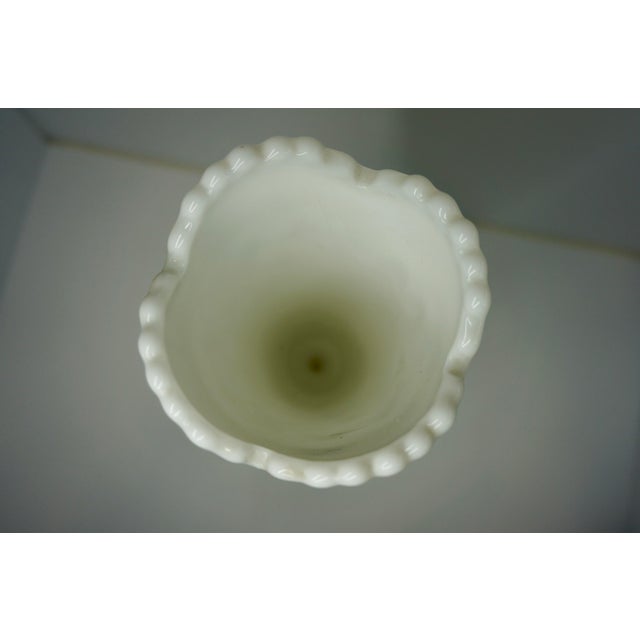 This striking vintage milk glass trophy vase stands a commanding 12 inches tall and features a substantial, high-quality...
