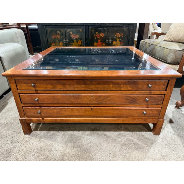 This Bob Timberlake glass top curio–style coffee table exemplifies the designer’s hallmark blend of American...