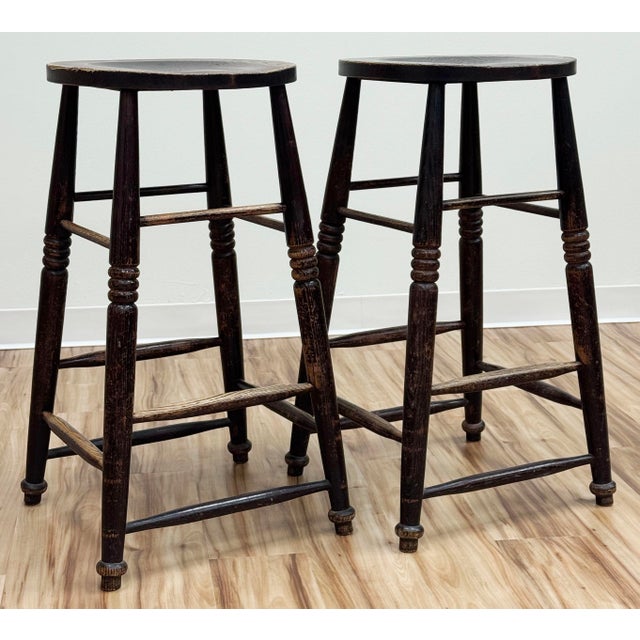 Early 20th C English style four legged stool with carved stretchers for support. Beautiful turned legs and natural patina...