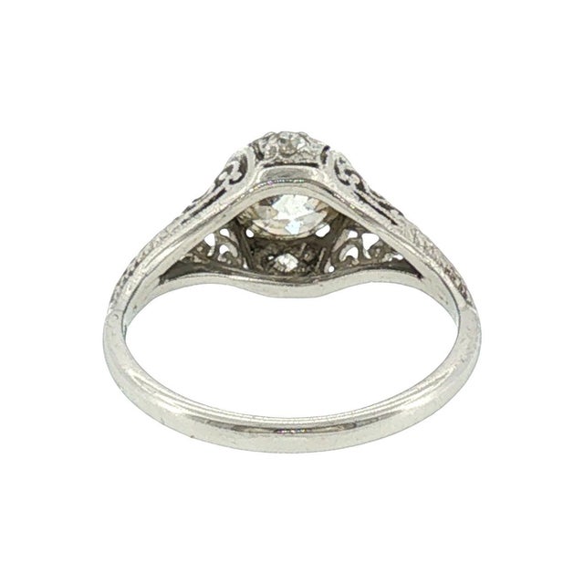 An Art Deco platinum hand-fabricated engagement ring. Features a 1.06 carat Old European cut diamond, GIA graded color J,...