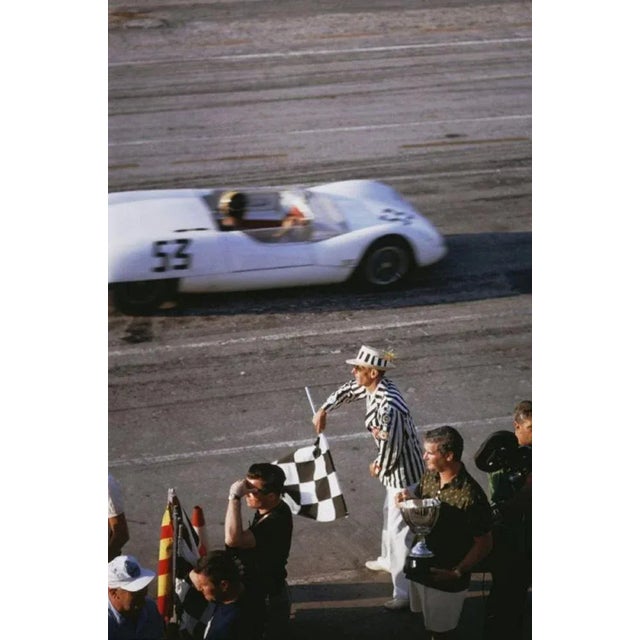Checkered Flag 1963 by Slim Aarons Slim Aarons Limited Estate Edition The checkered flag signals the end of the race...