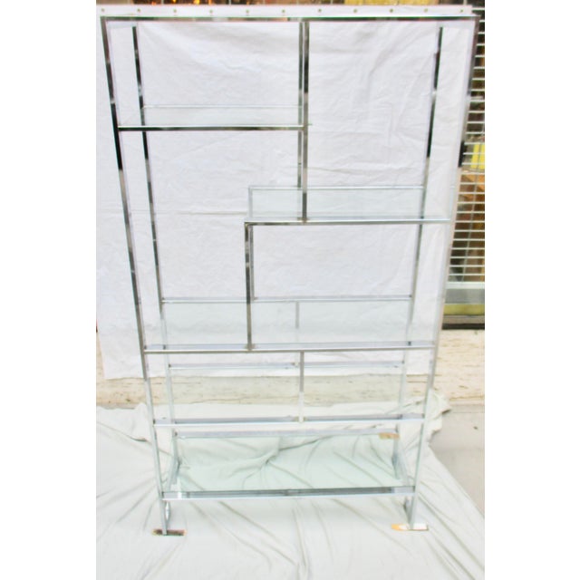 Chrome and steel etagere with 6 shelves, removable glass shelves 1/4 " thick, and the bottom shelf is 1/3 or more thick...