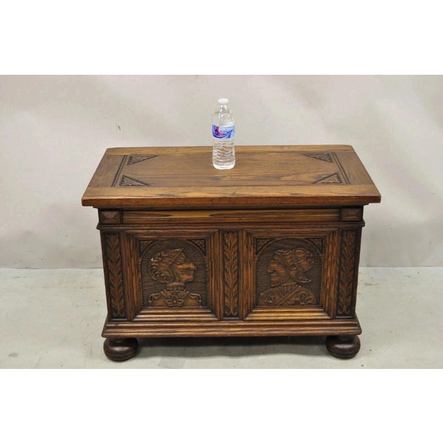 Antique Jacobean Oak Wood Figural Bust Carved Blanket Chest Trunk on Bun Feet. Circa Early 20th Century. Measurements:...