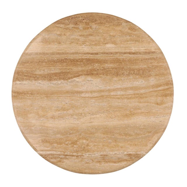 A sophisticated blend of natural materials and sculptural form, this round coffee table pairs a substantial travertine top...