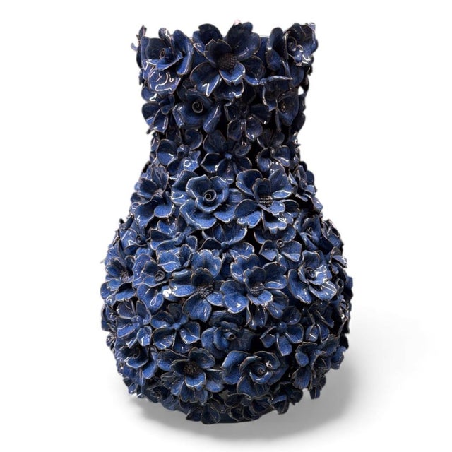 A spectacular and highly detailed indigo blue glazed ceramic vase, completely covered in three-dimensional, hand-applied...