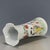 This is a charming vintage porcelain vase, decorated in the famille rose palette with vibrant polychrome enamels. The vase...