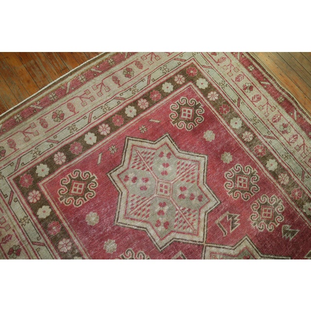 An early 20th century Crimson Red background Samarkand rug, predominant accents in gray-green and brown Measures: 5'4'' x...
