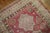 An early 20th century Crimson Red background Samarkand rug, predominant accents in gray-green and brown Measures: 5'4'' x...