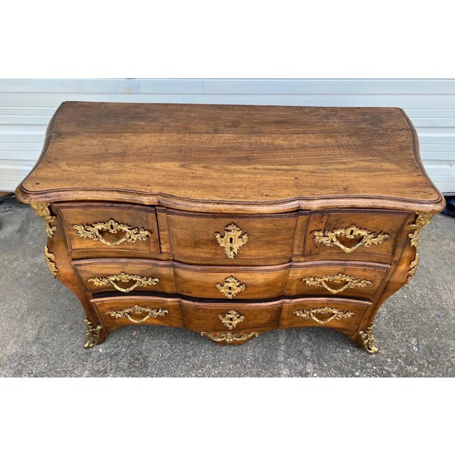 Fine 18th century French Regence period walnut and ormolu mounted commode or chest of drawers. Three drawers over two....