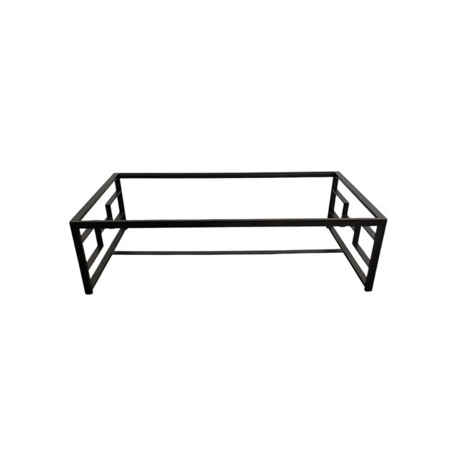 Iconic rectangular coffee table by Holly Hunt. The H Coffee Table is hand-forged of brass and has a deep patinated bronze...