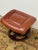 Design Plus Gallery presents a Faux Leather Footstool with Mid Century Vibes. The footstool is similar to Ekornes...