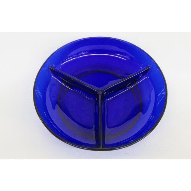 This charming Divided Serving Dish is made out of pressed glass. This gorgeous sectioned bowl features a deep cobalt blue...