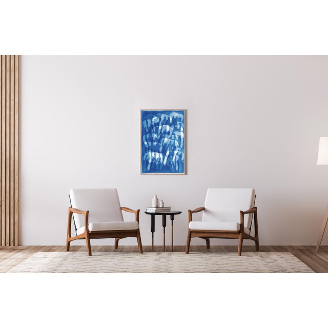 This unique monotype cyanotype, rendered in rich blue tones, invites the viewer into a dreamlike rhythm of interwoven...