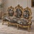 Make a spectacular statement with this opulent French Rococo-style settee, featuring an exceptionally ornate carved frame...
