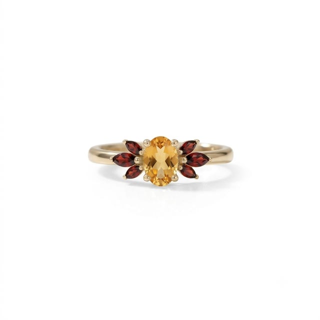 Embrace vibrant color and striking design with this beautifully crafted Oval Citrine and Garnet Cluster Ring. At its heart...