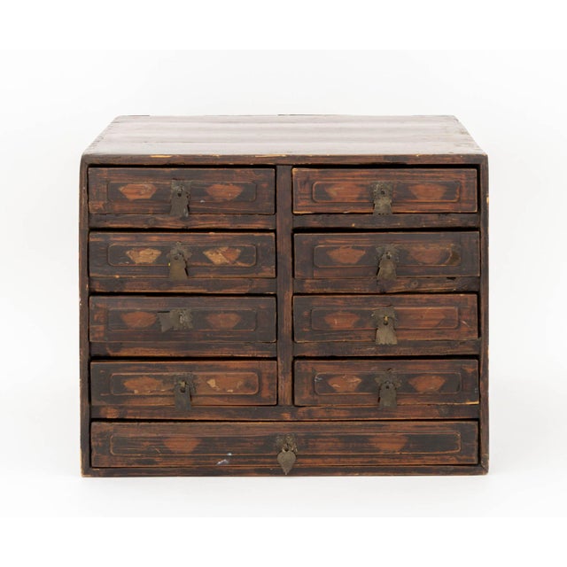 Chinese Elm Table-Top Chest of Drawers, late 18th century, with eight short drawers and one bottom frieze drawer and iron...