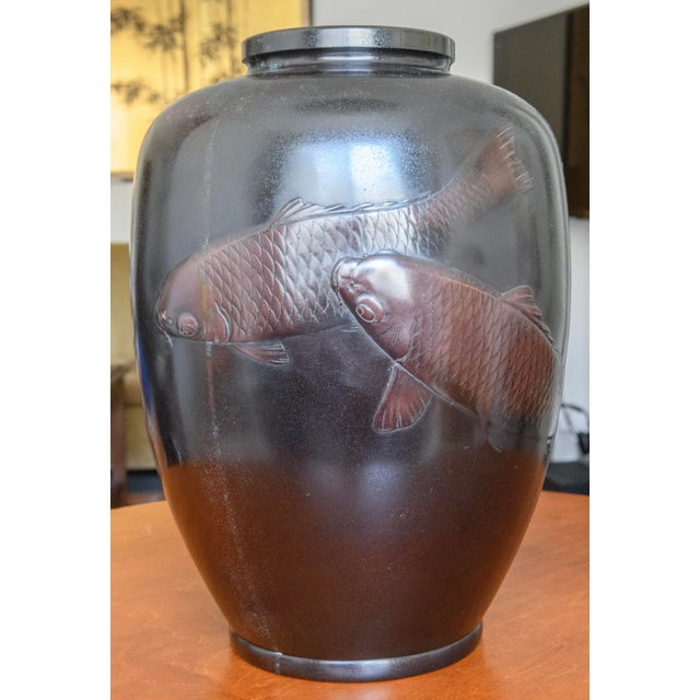 Art Deco bronze vase with two swimming Koi fish in relief. Hand made in Japan in 1930's. Signed by the artist.