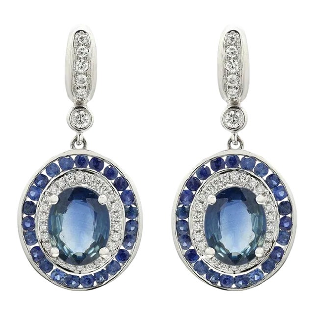 This is part of Chairish’s Fine Jewelry assortment. Blue Sapphire Dangle earrings to make a statement with your look....