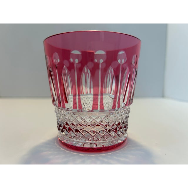 An exceptional set of 15 Saint-Louis crystal old-fashioned glasses in the iconic Tommy pattern, presented in a rich ruby-...