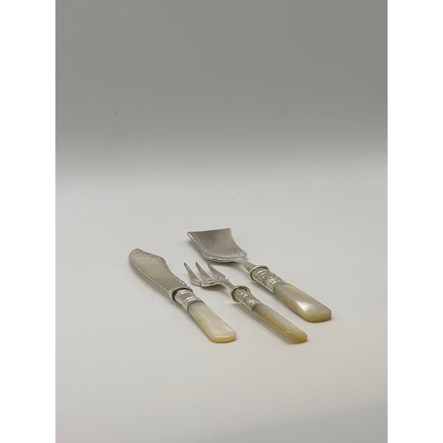 Elegant antique Sheffield silverplate petit set, featuring genuine mother-of-pearl (nacre) handles with finely detailed...