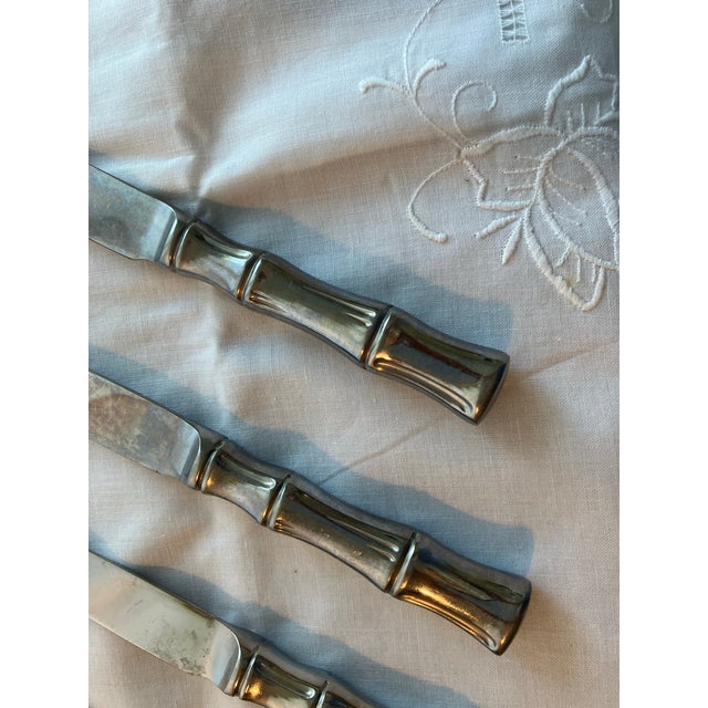 Heavy set of 8 Supreme stainless steel dinner knives in great condition, from mid-century. In the bamboo pattern.