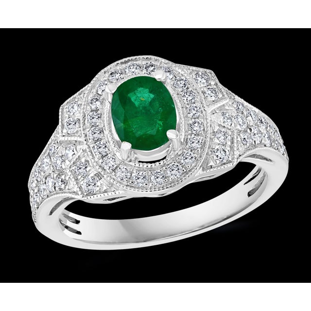 0.80 Carat Oval Cut Emerald and 0.85 Carat Diamond Ring 18 Karat White Gold For Sale - Image 17 of 18