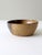 This signed studio pottery bowl features a beautiful two-tone glaze in warm earth tones. Its handcrafted character and...
