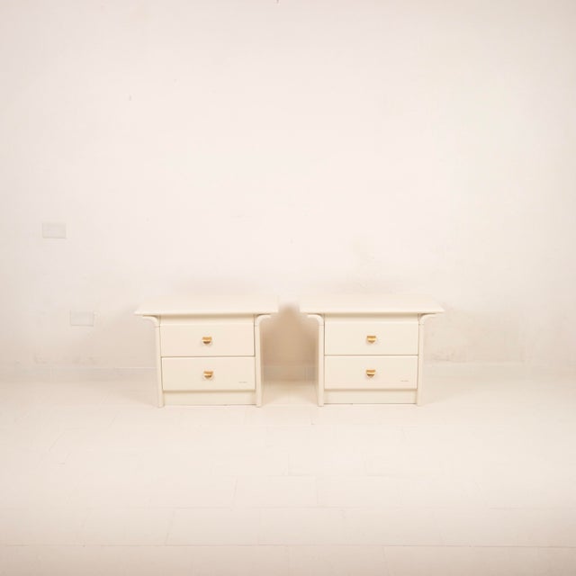 Overview Rare pair of cream lacquered bedside tables by Pierre Cardin, Italy, 1980s. Sculptural and refined pieces that...