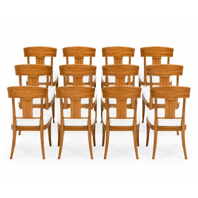 Set of 12 Teak Klismos patio chairs. The chairs are made of solid Peruvian Teak. Finished and ready to enjoy. Set is well...