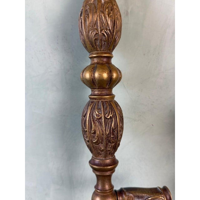 A striking pair of monumental cast bronze door pull handles, richly detailed with classical ornamentation and a...