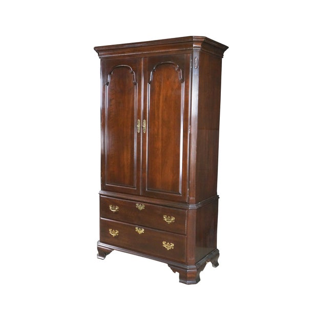 This Ethan Allen Georgian Court cherry armoire showcases classic 18th-century English styling paired with exceptionally...