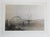 Mid 20th century double exposure snapshot photograph of Yaquina Bay Bridge in New Port, Oregon with a ghostly figure of a...