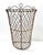 This tall antique wire basket features a beautifully hand-woven open lattice form with a sculptural, decorative rim...
