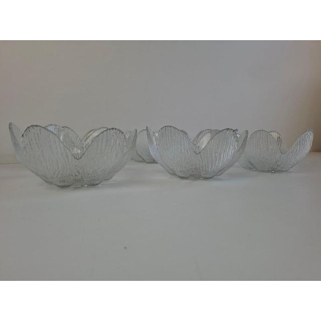 Elegant set of six Bohemia Glass dessert bowls made in Czechoslovakia circa 1960. Each clear glass bowl has a sculptural...