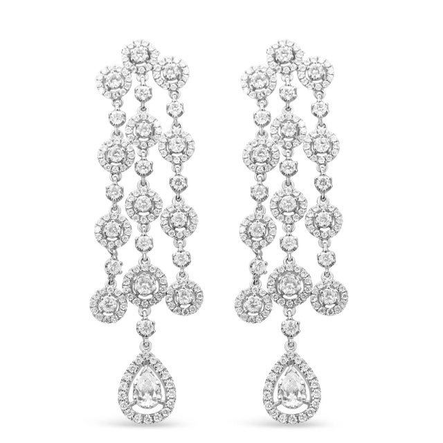 Light up the night in these ravishing waterfall diamond earrings that boast a beautiful, sparkling movement that will have...