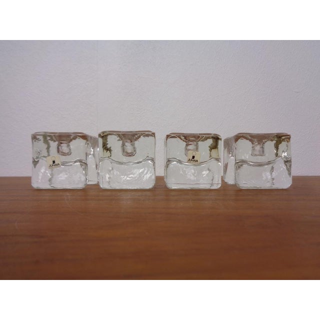 Set of 4 ice cubes of candlesticks from the 1970s. If you turn the candlestick, you can also use them as a napkin holder....