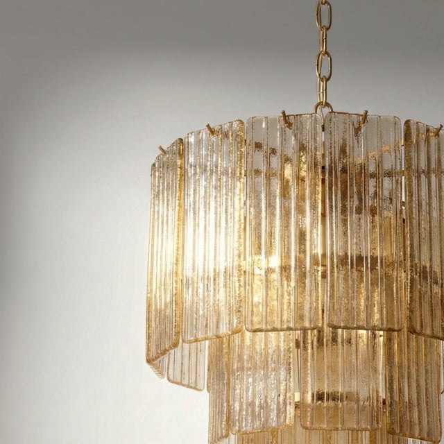 This striking Italian light fixture stands out for its cascading design, formed by a dense composition of rectangular...