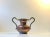 A sculptural handled vase in hand embossed copper. It displays all the right elements of Scandinavian Brutalism. Anonymous...