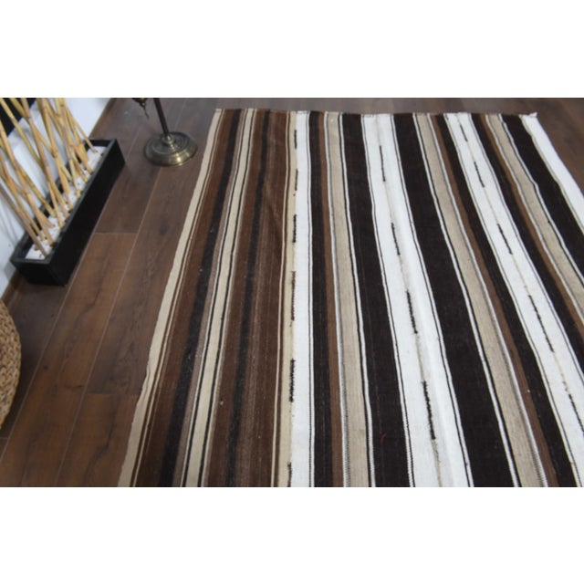 Vintage Hand-Knotted runner rug is a semi-antique vintage area rug. The '70s Eastern region of Anatolia's unique rug is...