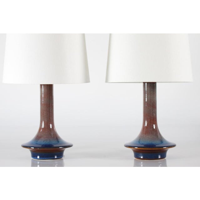 Rare pair of sculptural ufo sharped table lamps made by Søholm Stentøj model no. 1068, Denmark, circa 1960s. The lamps are...