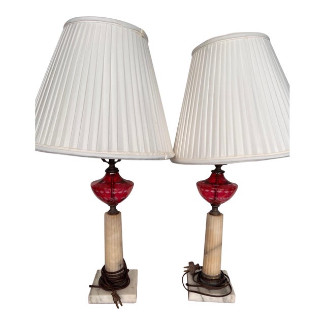Re-worked from 19th Century oil lamps these cranberry, alabaster and marble lamps with their pleated silk shades work well...