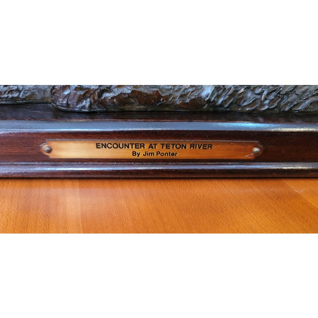 This is A Franklin Mint Composite Sculture 1980s. Jim Ponter Encounter at Teton River/ Buffalo Hunt on wood stand.