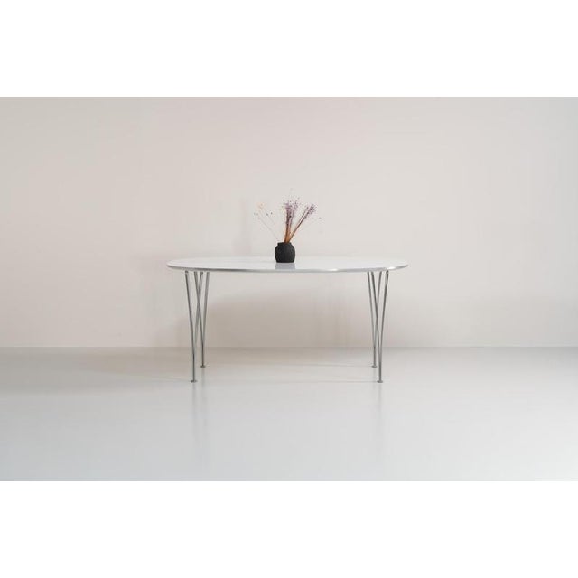 Superelipse dining table by Bruno Mathsson & Piet Hein for Fritz Hansen (Denmark, 1985s). A wonderful dining table with a...