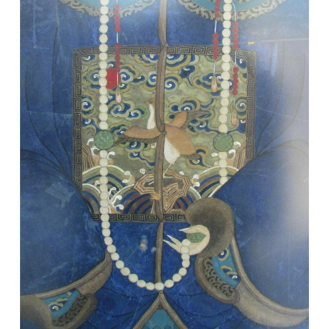 Traditional ancestor portrait. Hand-painted image Gauche on paper, of seated Mandarin senior with deep blue robes, a...
