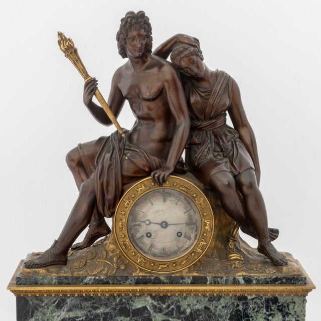 An impressive French Empire/Restoration period figural mantel clock, circa 1830, executed in patinated and gilt bronze and...
