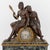 An impressive French Empire/Restoration period figural mantel clock, circa 1830, executed in patinated and gilt bronze and...