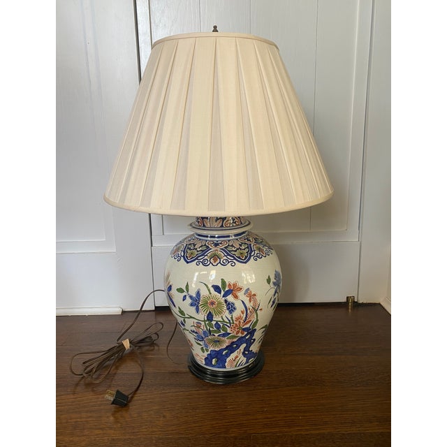 Beautiful poly-chrome French Faience jar mounted as a table lamp. Tones of cobalt blue, terracotta and olive green....